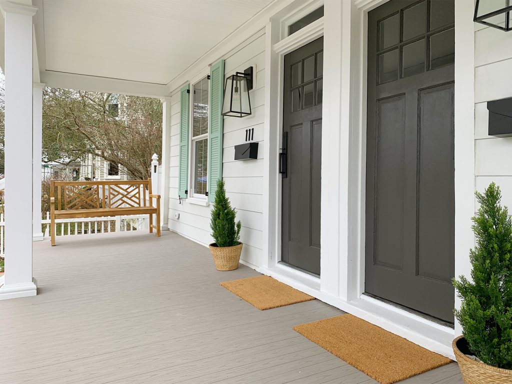 After Angle Of Front Porch With No Railing Wooden Bench And Composite Deck Flooring