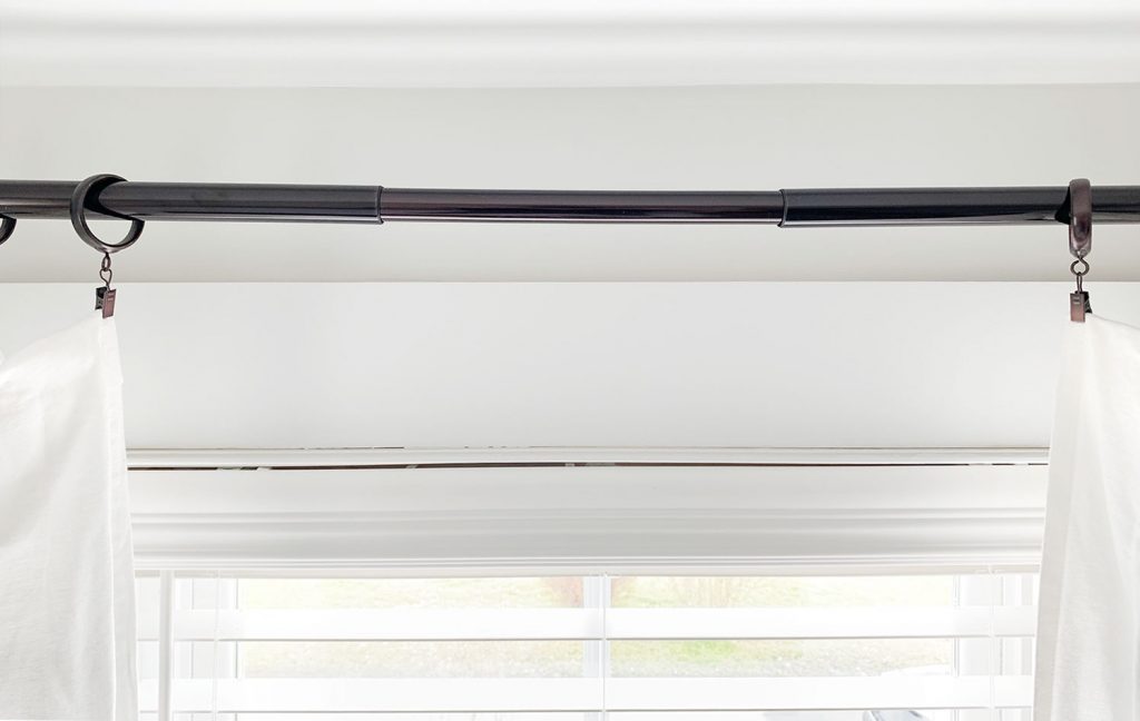 Hang trash bags on a curtain rod in the garage for easier access