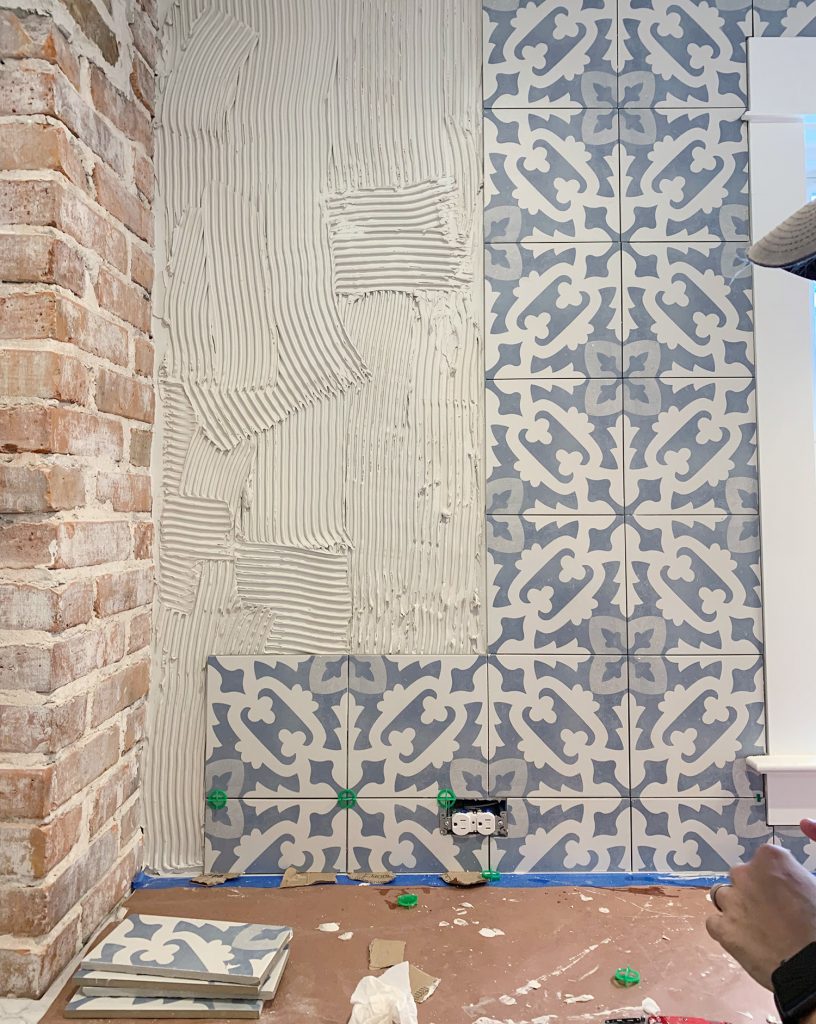 Detail Of Backsplash Installation Progress With Blue Patterned Tile
