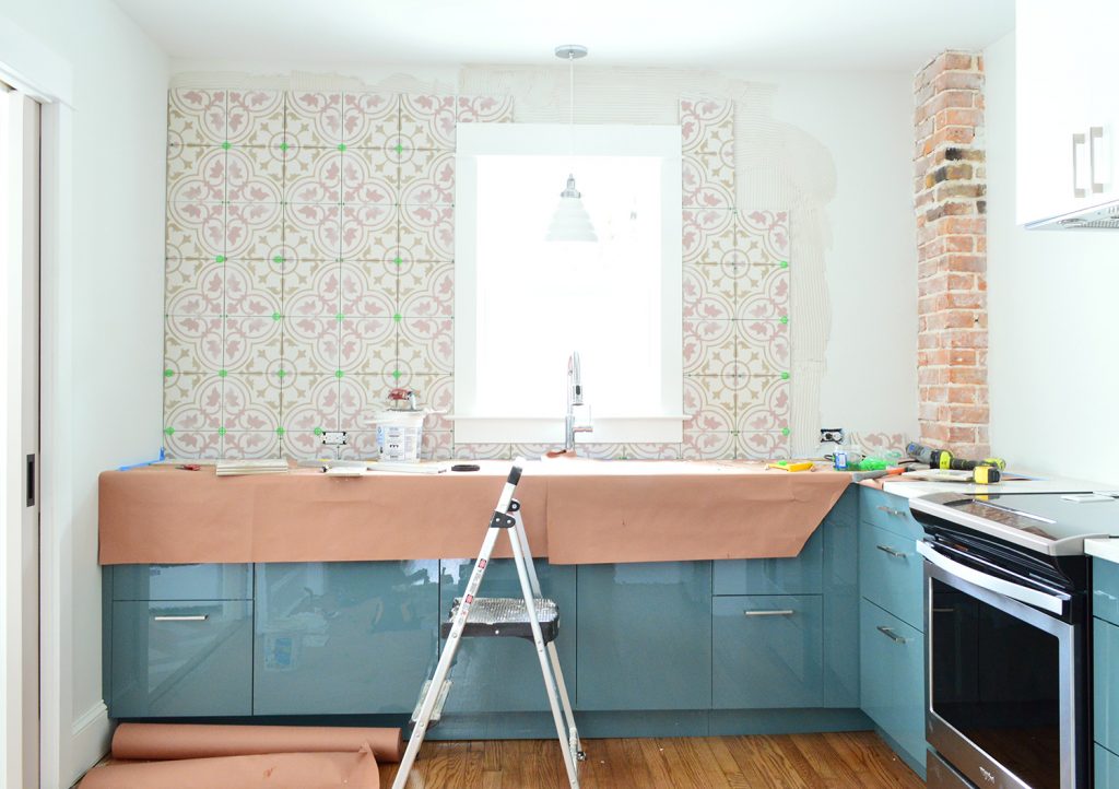 Pink Patterned Backsplash Tile In Blue Kitchen Mostly Completed