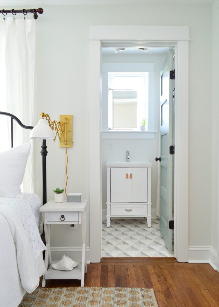 Small En Suite Bathroom With Pattern edMarble Tile Floor