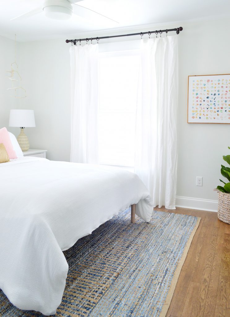 After Of Front Bedroom With Blue Rug And White Curtains And Bedding