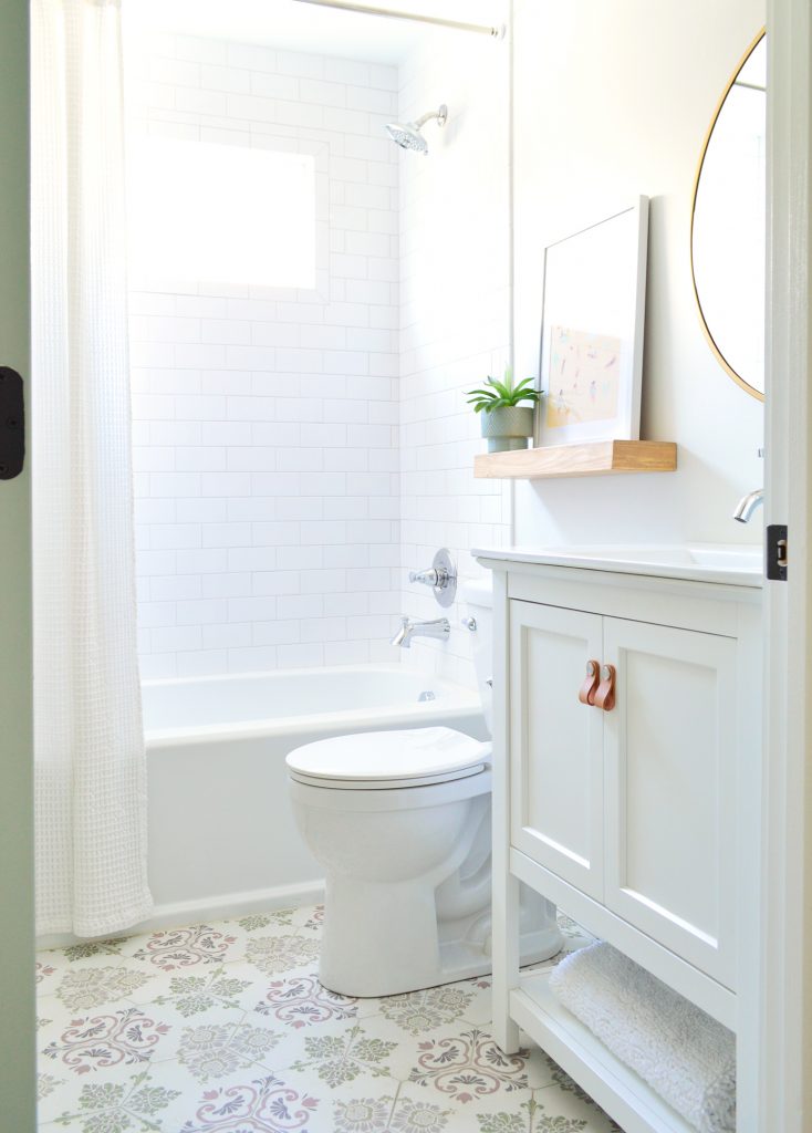 Hall Bathroom With Colorful Pink And Green Hex Tile Floor And Subway Tile Backsplash