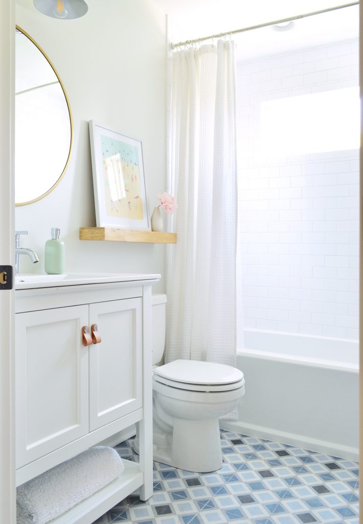 After Photo Of Hall Bath With Blue Patterned Tile Floor And Subway Tile Shower