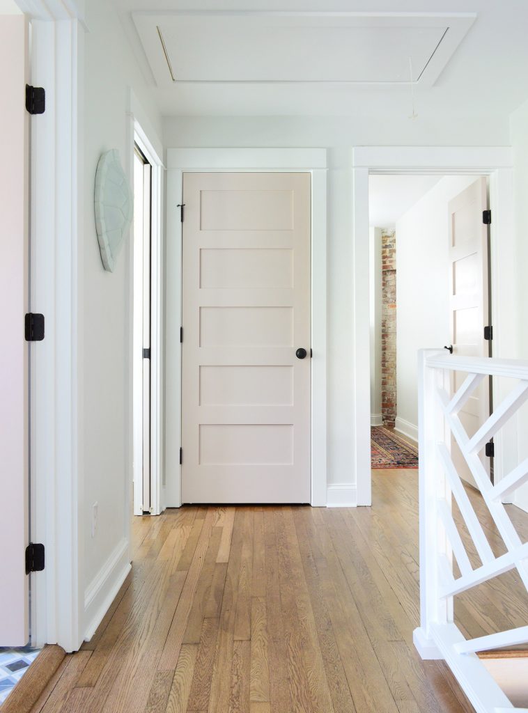 After Photo With Moved Doors And Added Linen Closet And Decorative Railing | White Truffle Painted Doors