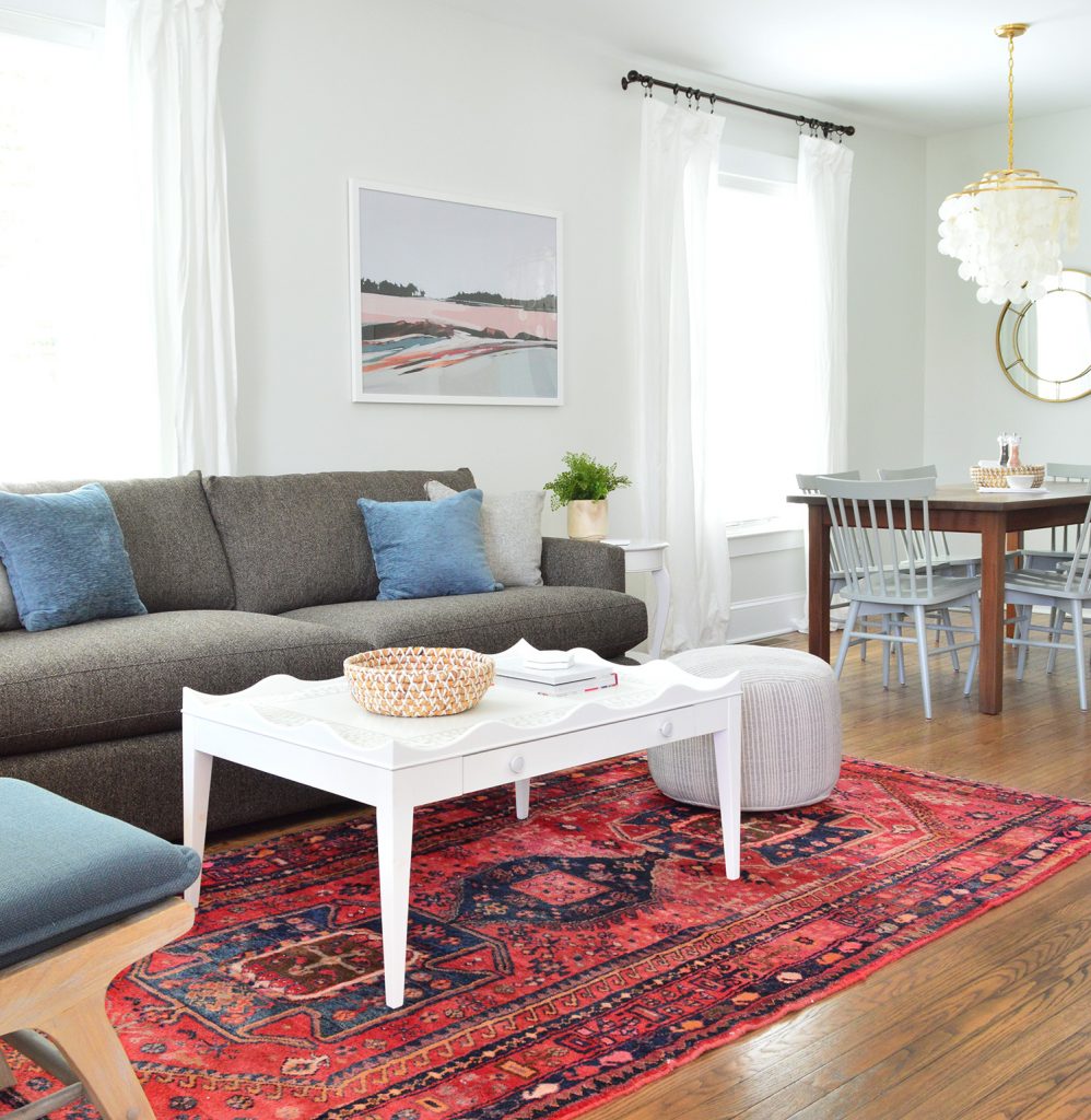 Scallop Coffee Table on Red Rug With Crate And Barrel Sofa