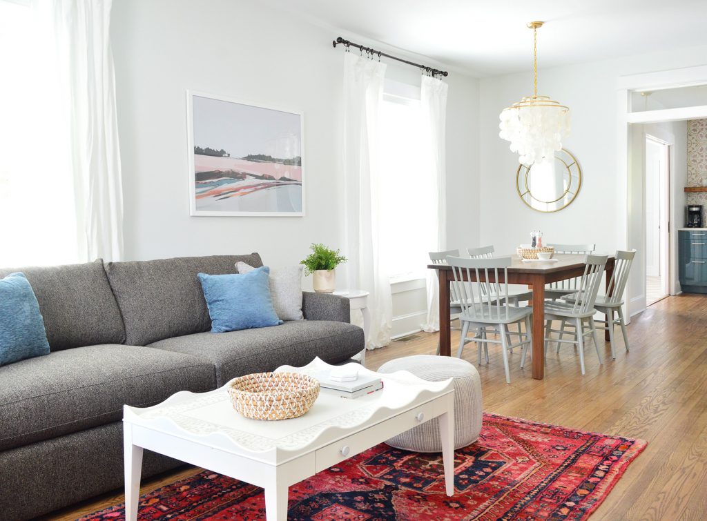Open Living Dining And Kitchen With Crate And Barrel Sofa And Scallop Coffee Table