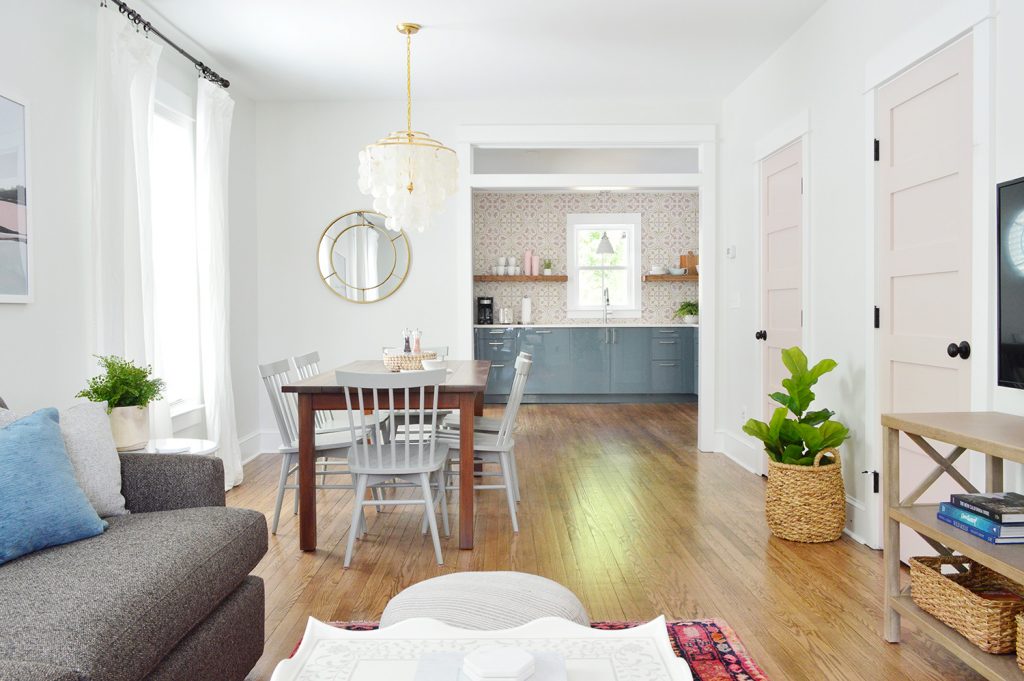 Duplex Living Room With View Into Kitchen With Blue Cabinets