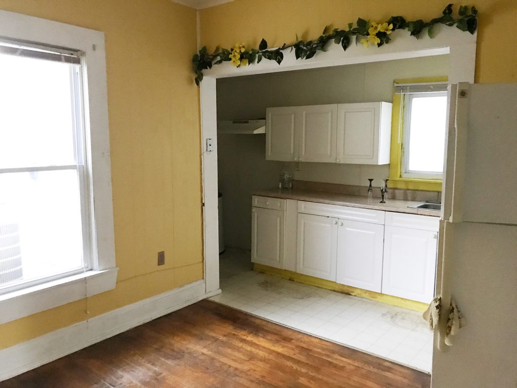 Before Photo Of Kitchen With Yellow Paint And Small Hallway Galley Layout