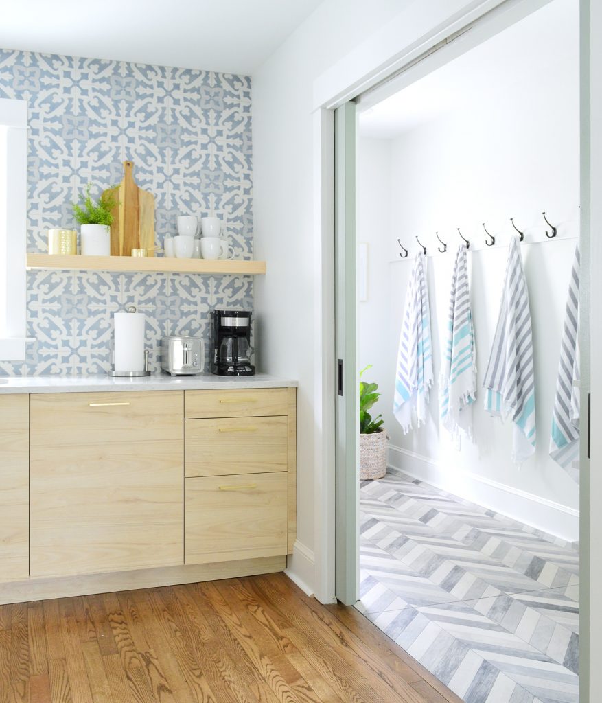 Duplex Mudroom Seen Through Kitchen Pocket Doors