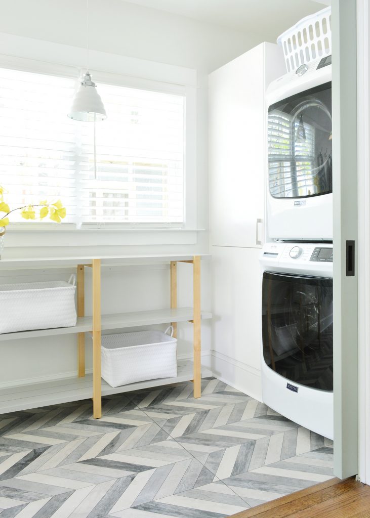 Duplex Laundry Room With Open Shelf And Stacked Laundry