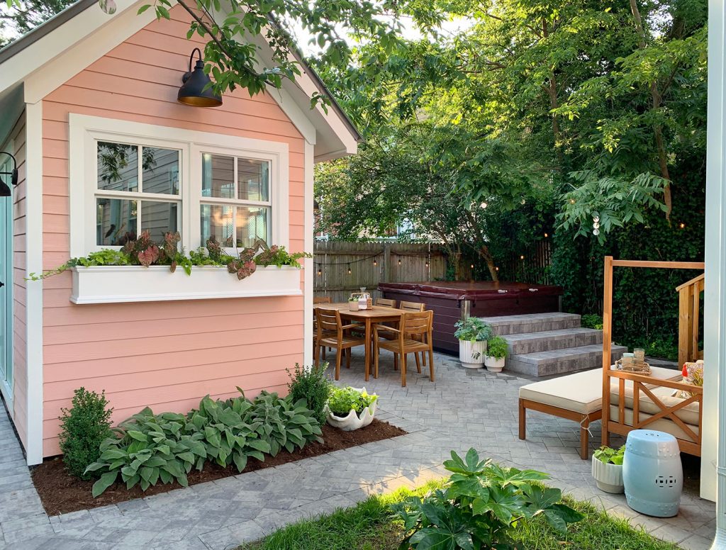 Pink Shed In Beach House Backyard With Paver Patio Pathways Dining Table and Hot Tub