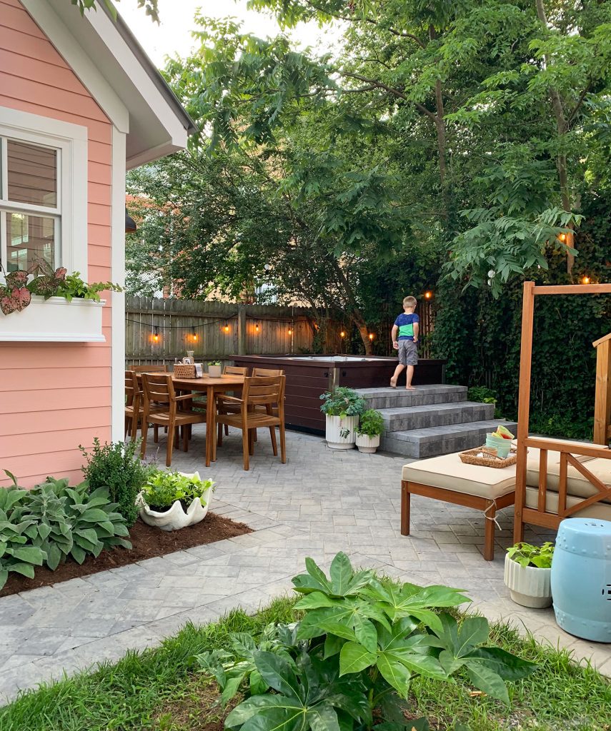 After Of Beach House Backyard With Pink Shed Paver Stone Patio And Hot Tub