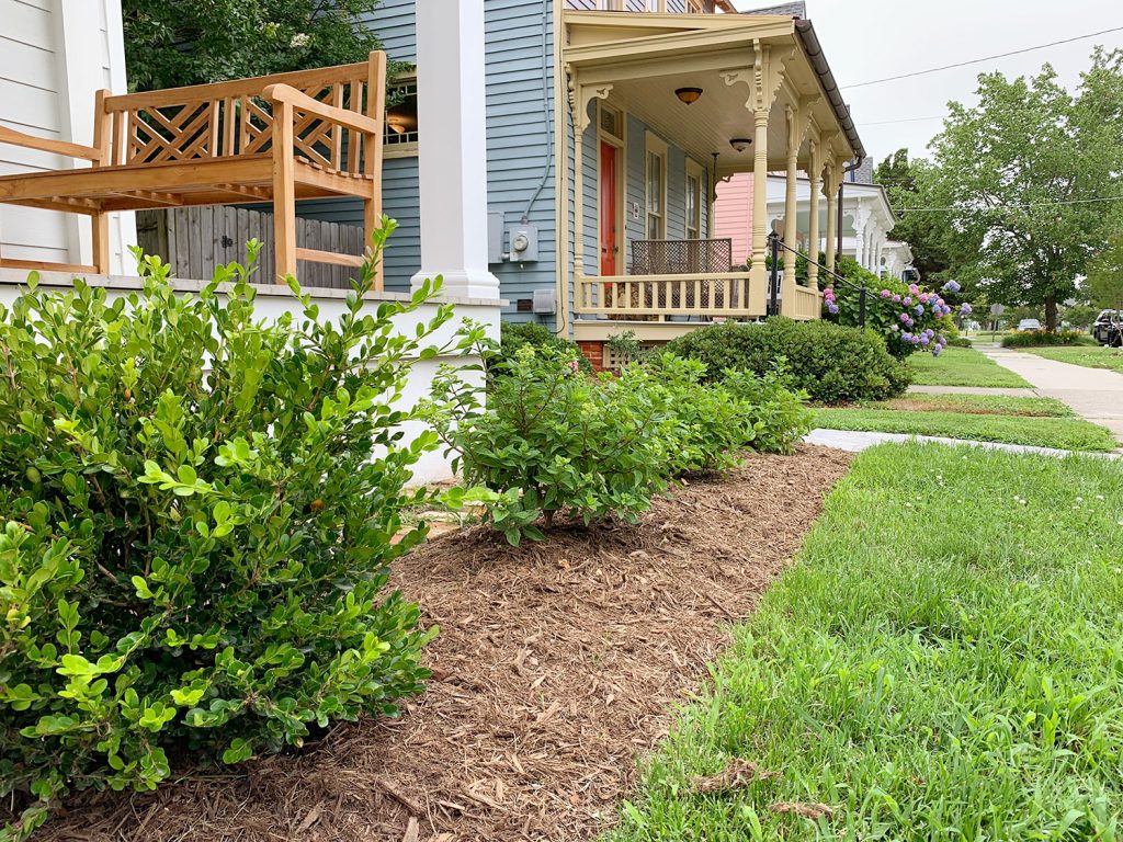 Duplex Front Landscaped Close Up On Bushes Horizontal