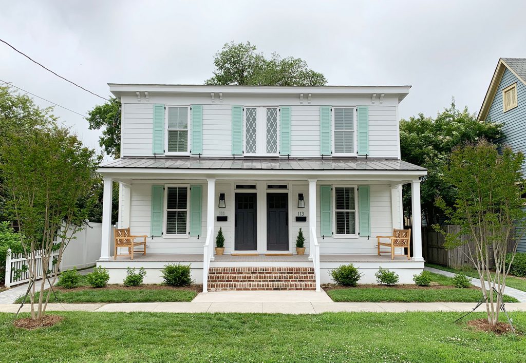 Wide Angle of Finished Duplex With Diamond Windows Pale Patina Shutters And Open Proch