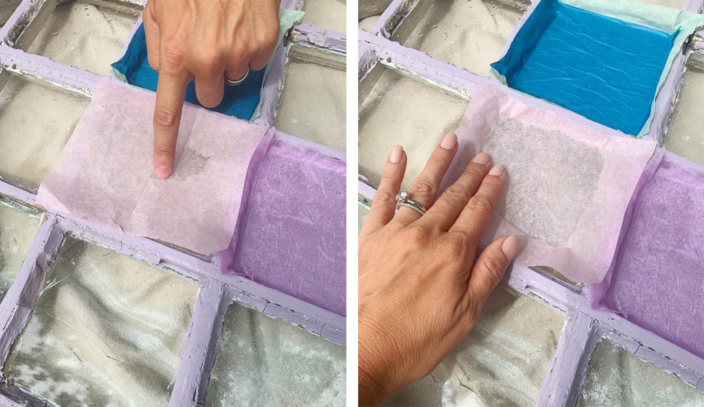 Pressing Sheet Of Pink Tissue Paper Onto Glass Pane