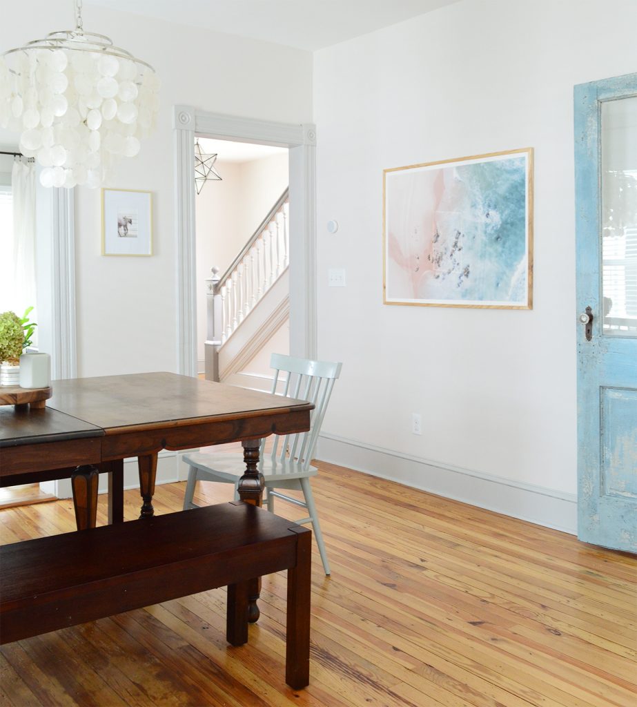 After Photo Of Beach House Dining Room With Pink Blue Beachy Painting On Wall And Restored Shabby Chic Door