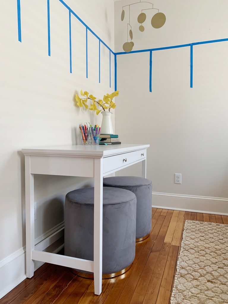 Beach House Desk With Ottomans Pushed In