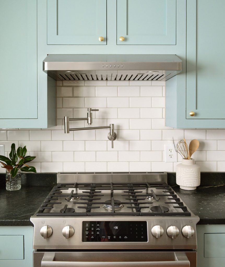 Pot Filler Over Stainless Steel Gas Range On Subway Tile Backsplash