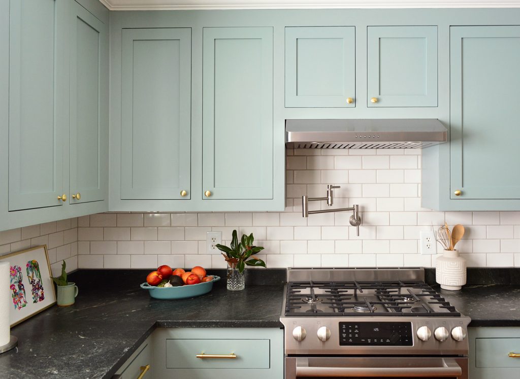 Halcyon Green Blue Kitchen Wall Cabinets With Gold Brass Knobs Above Stove