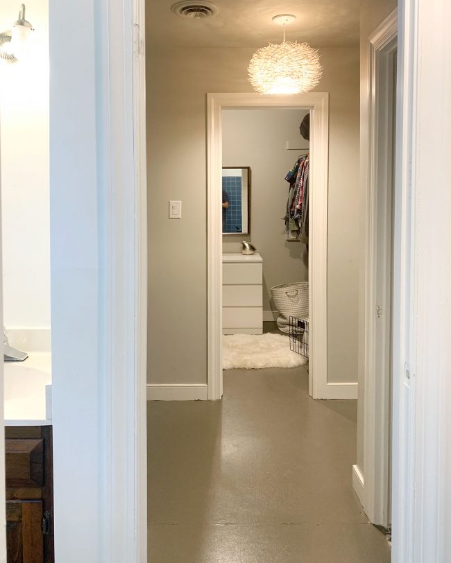 Before Photo Of Walk In Closet With Narrow Entry And Bare Painted Floor