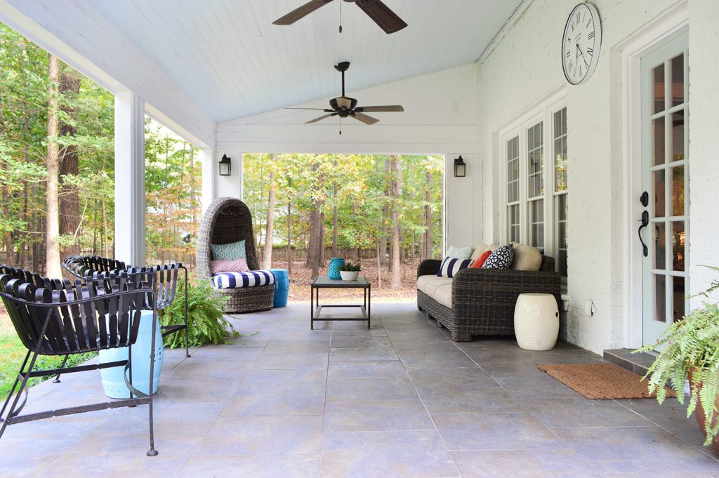 Cover sunroom patio with tile floor and vaulted blue ceiling