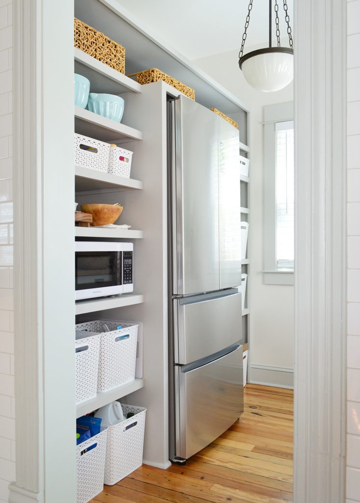 Walk In Beach House Pantry With More Baskets On Shelves