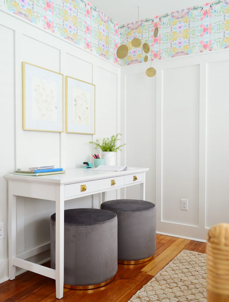 White Writing Desk Against White Board And Batten With Pouf Ottoman Seats