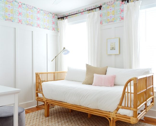 A Beach House Bedroom With Wallpaper And Board & Batten