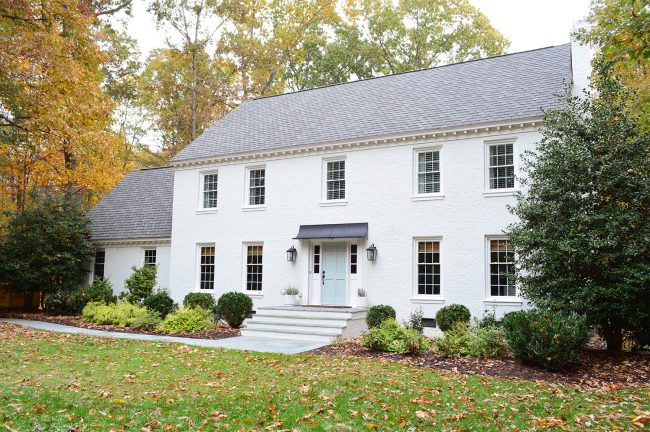 After Photo Of Brick Colonial Home Painted With Moderne White Romabio Paint