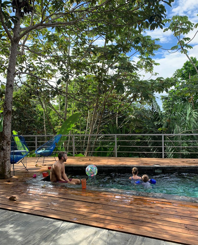 Dad Playing With Kids At Pool In Costa Rica Jungle