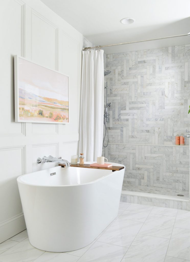 Freestanding Tub In Modern Marble Bathroom With Traditional Wall Molding Treatment