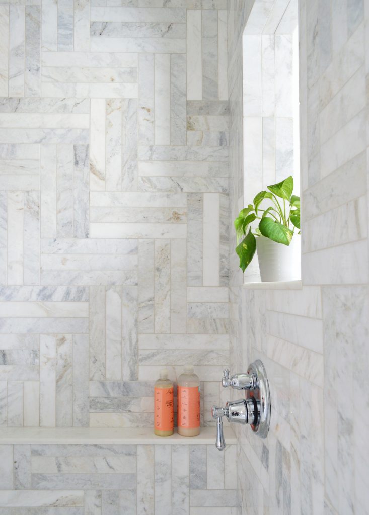 Plant Window Ledge In Walk-In Shower To Let Light Into Modern Marble Tile Shower