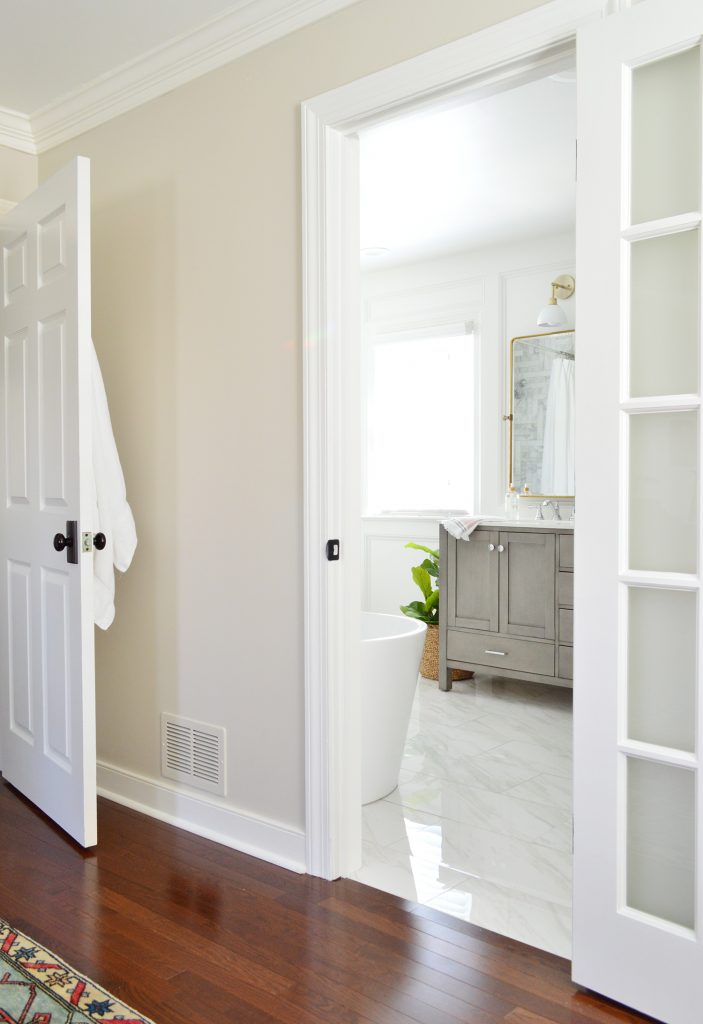 Marble Master Bathroom Through Doorway Angle With Towels