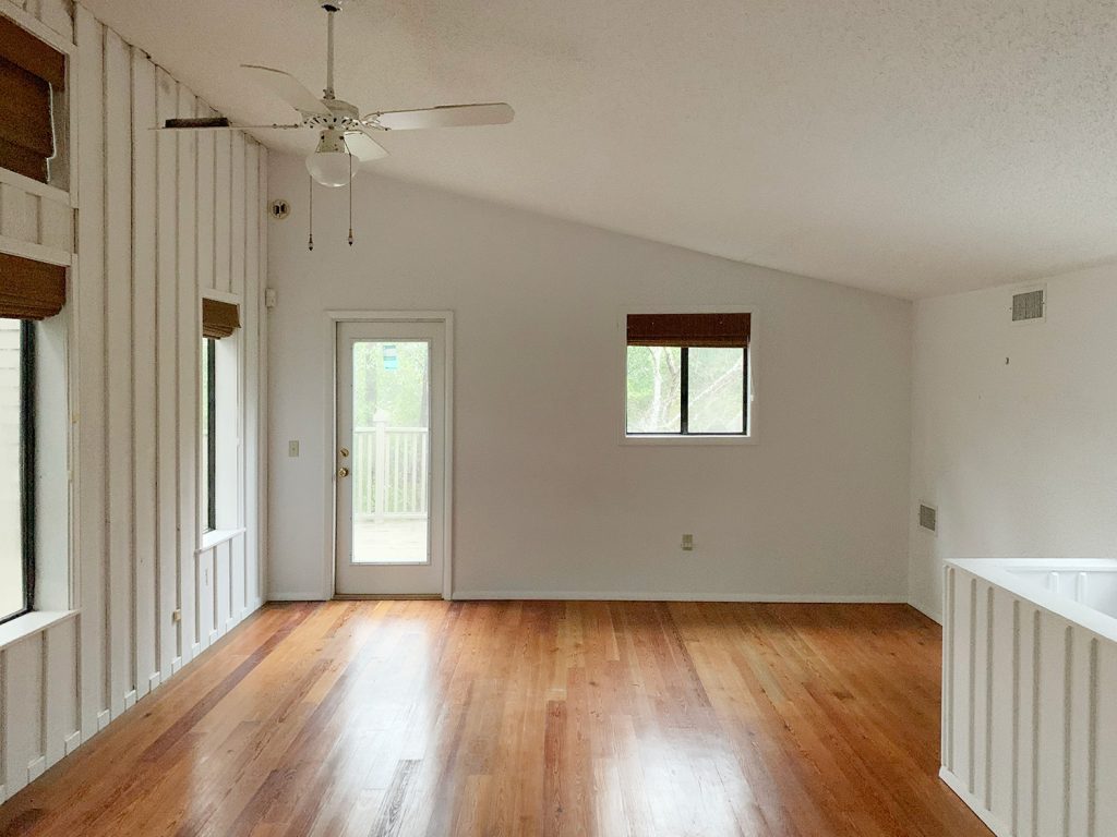 Before Photo Of Other Side Of Upstairs Family Room With Vaulted Ceiling And Hardwood Floors