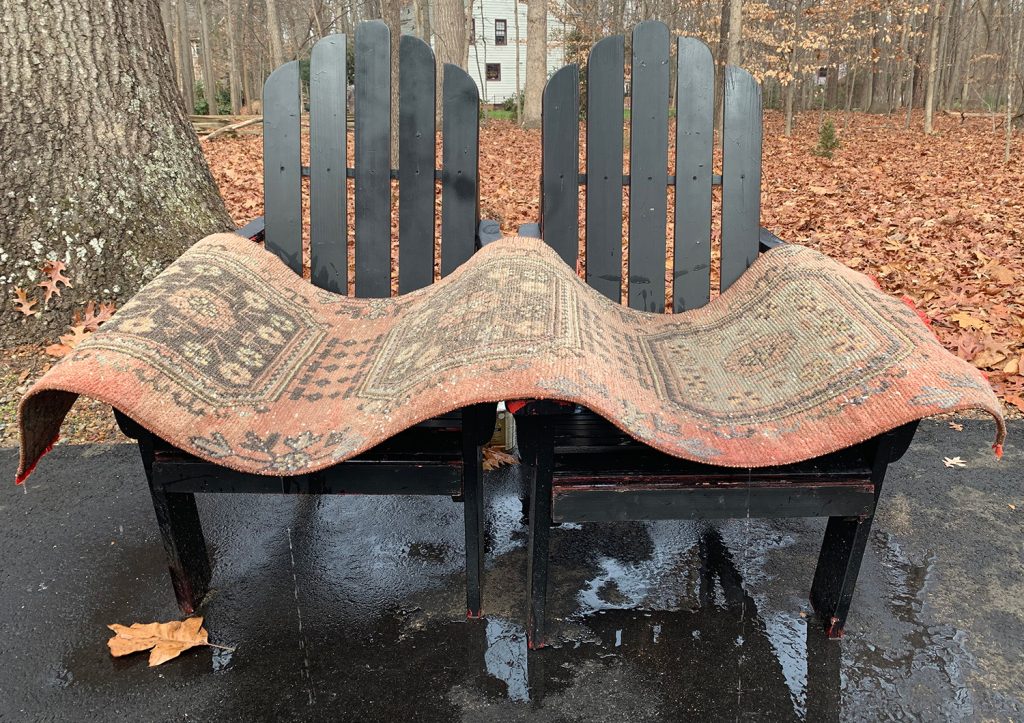 Power Washing Rug Dripping Dry