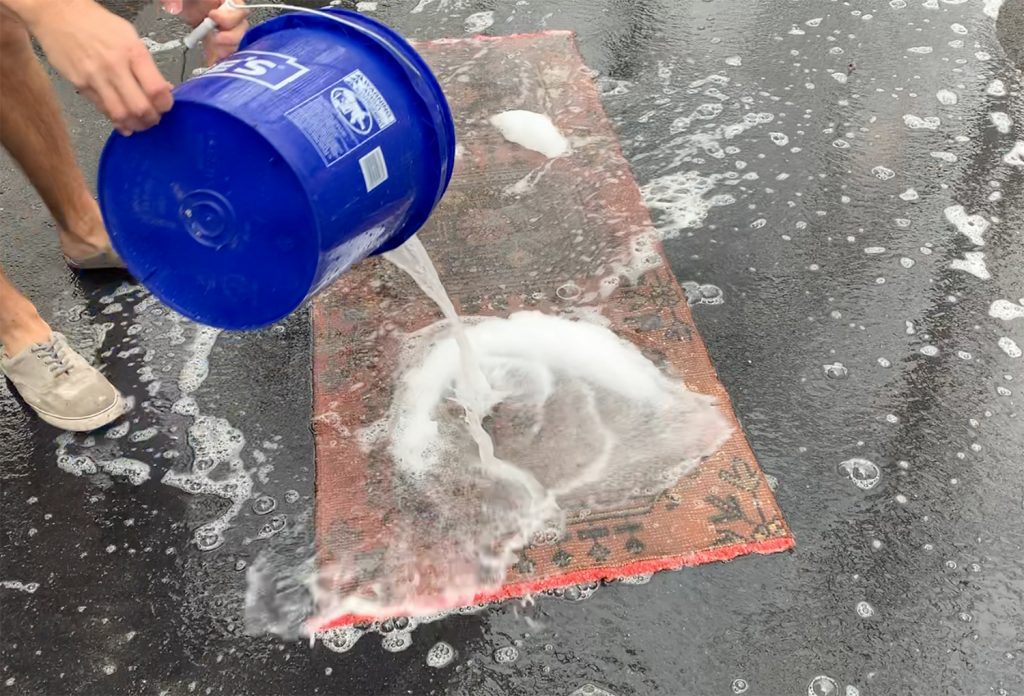 Power Washing Rug Soaking With Water