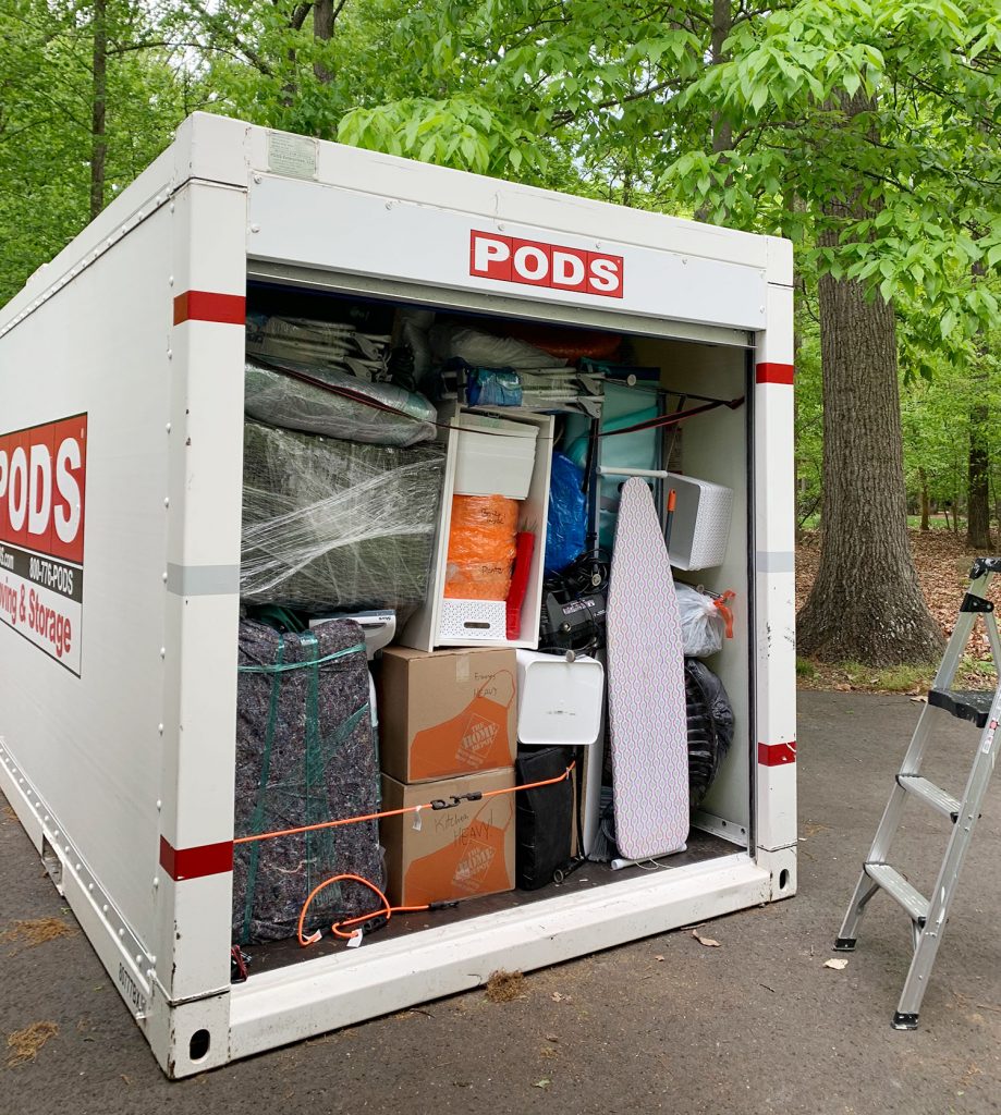 PODS Storage cube packed to edge with furniture and accessories
