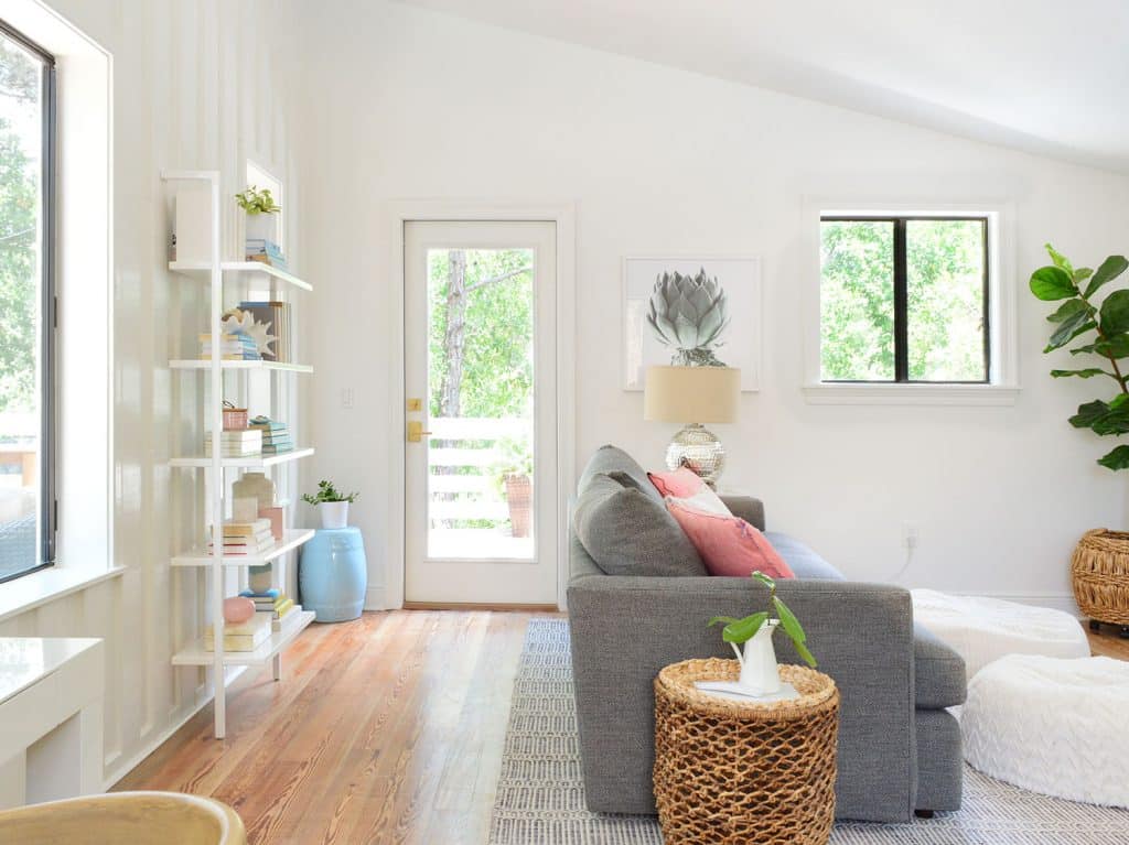 Beachy Living Area With Walkway Behind Couch To Upstairs Deck