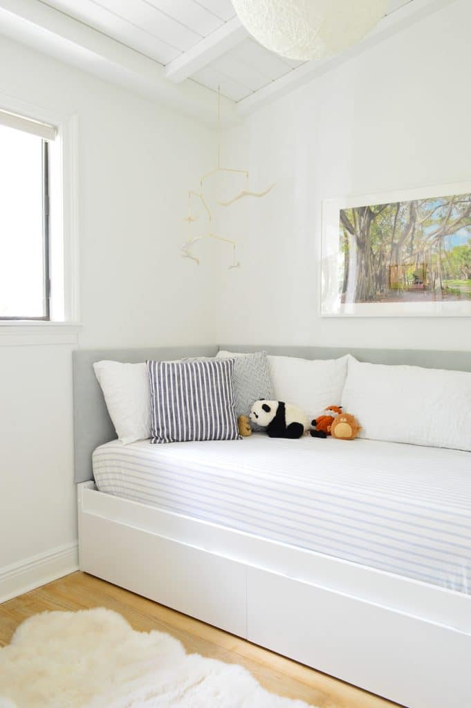 Built-in boys daybed with fabric headboard on two sides