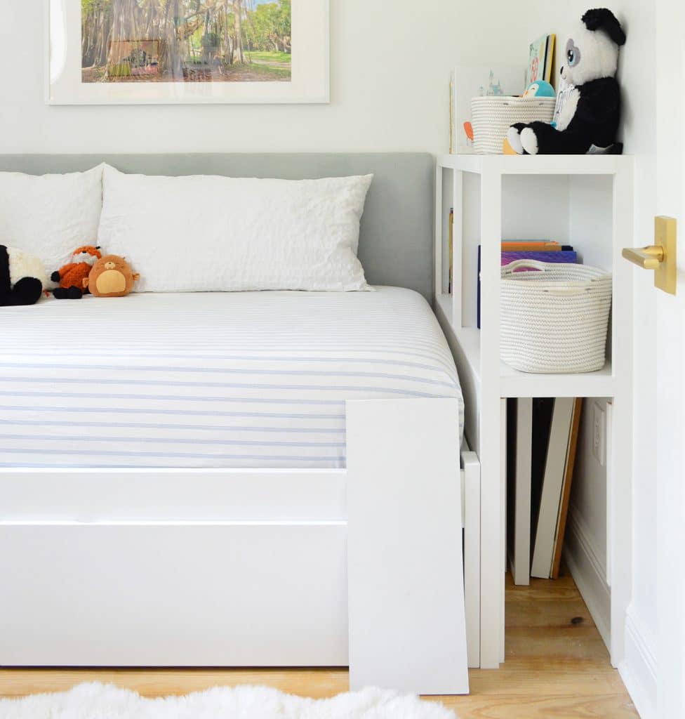 Bottom compartment for secret storage in boys bedroom with built-in daybed custom storage