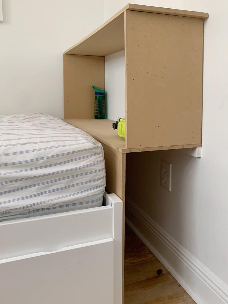 MDF frame of built-in bookcase in boys bedroom during DIY construction