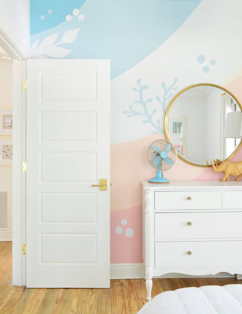 Colorful mural in girls room with organic stripes and ocean plants