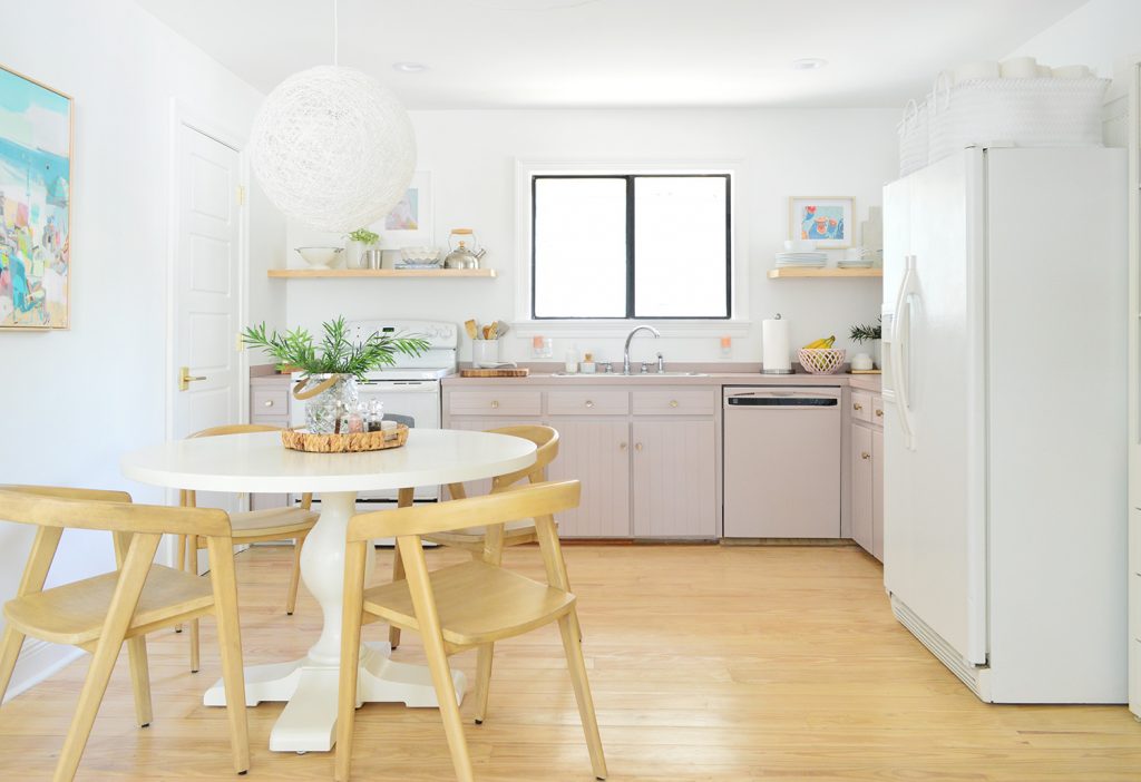 Full view of simple white kitchen with mauve lower cabinets | Sherwin Williams Artsy Pink