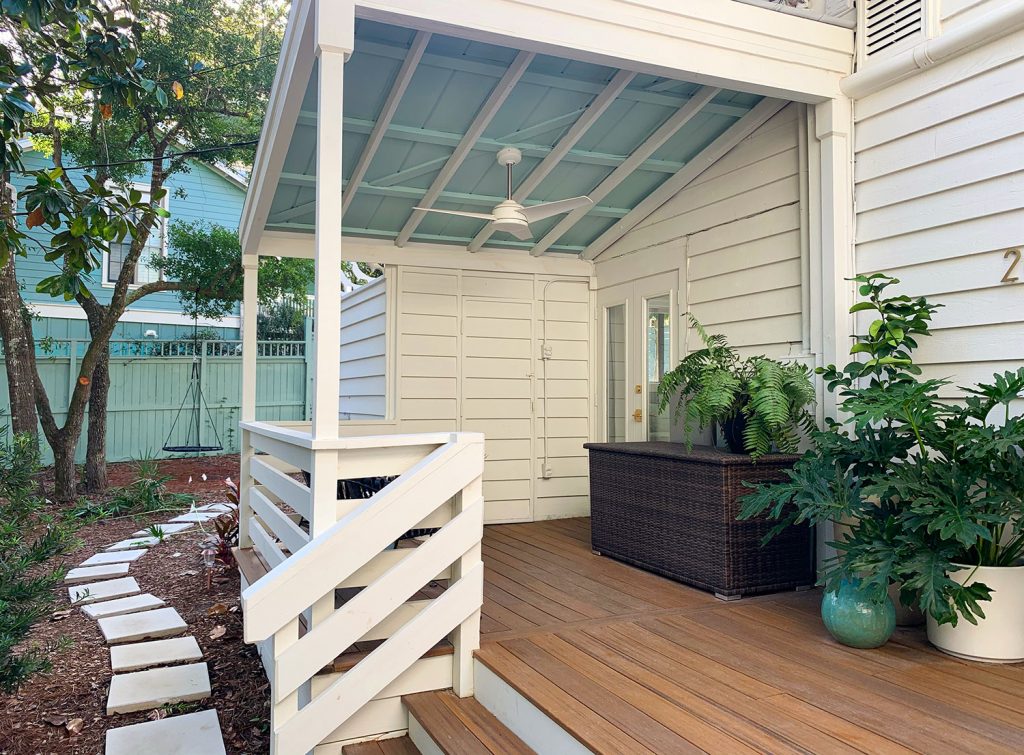 Covered Porch With Painted Blue Ceiling And White Ceiling Fan