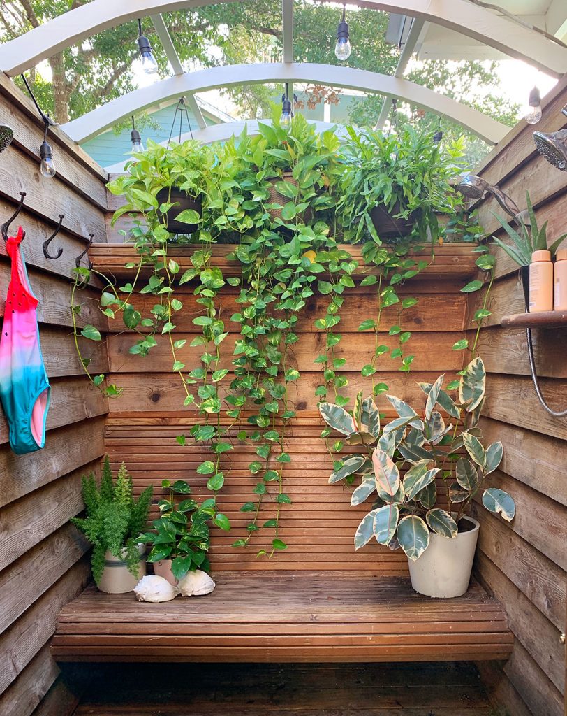 Wood Slatted Outdoor Shower With Cascading Hanging Plants