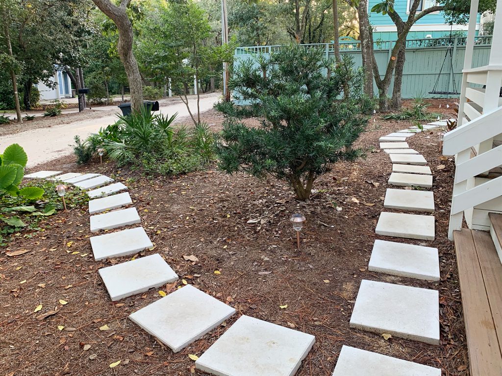 Square White Paver Pathway Around Mulched Front Yard