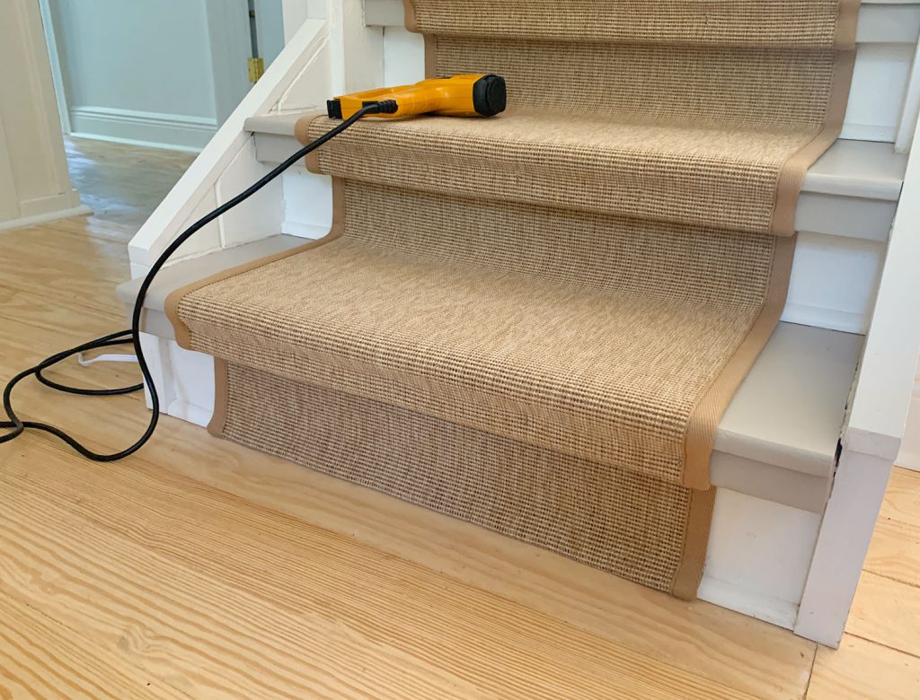 Bottom Step Of Staircase Showing Folded End Of Sisal Stair Runner