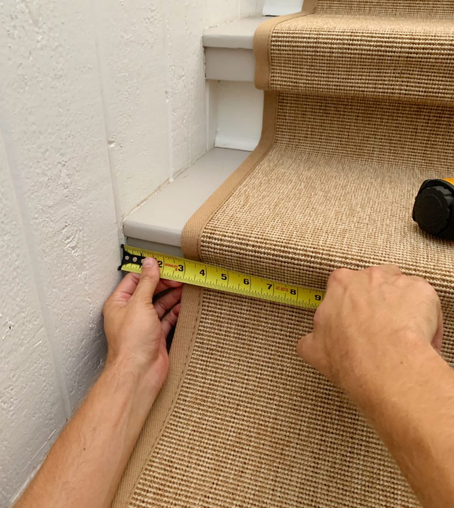 Measuring Tape Checking Placement Of Sisal Stair Runner