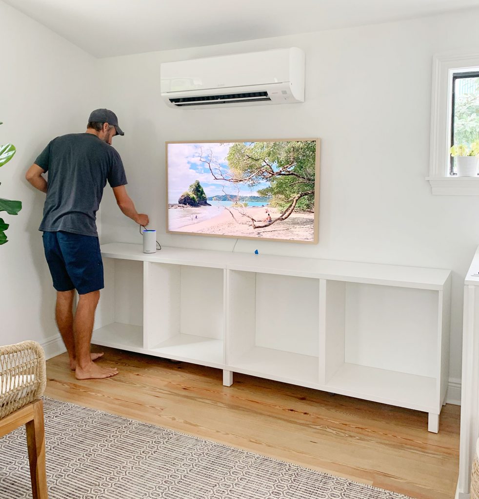 John Working On Installing Ikea Besta Cabinets In Family Room